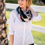 Model Wearing Alpine Cashmere's Featherweight Cinta Scarf in Black and Cranberry Red