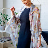 Model Wearing Alpine Cashmere's Featherweight Cinta Scarf in Pearl Gray and Blue