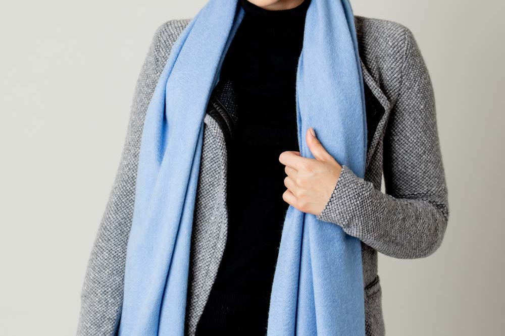 Model Wearing Alpine Cashmere Ripple Finish Wrap in Azure Blue