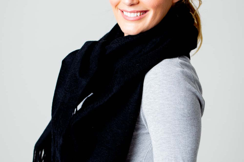 Model Wearing Alpine Cashmere Ripple Finish Wrap in Black