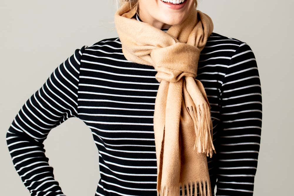 Model Wearing Alpine Cashmere Ripple Finish Scarf in Camel