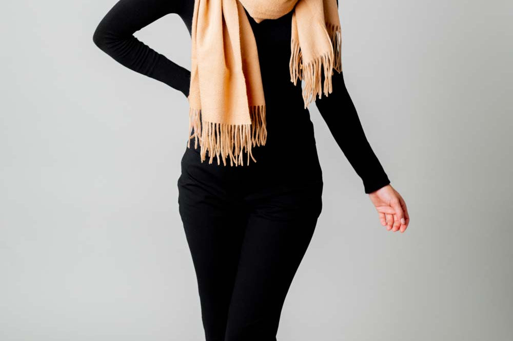 Model Wearing Alpine Cashmere Ripple Finish Wrap in Camel