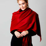 Model Wearing Alpine Cashmere Ripple Finish Wrap in Cherry Red