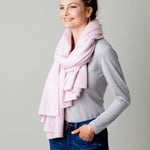 Model Wearing Alpine Cashmere's Luxurious Chunky Travel Wrap in Ballet Pink
