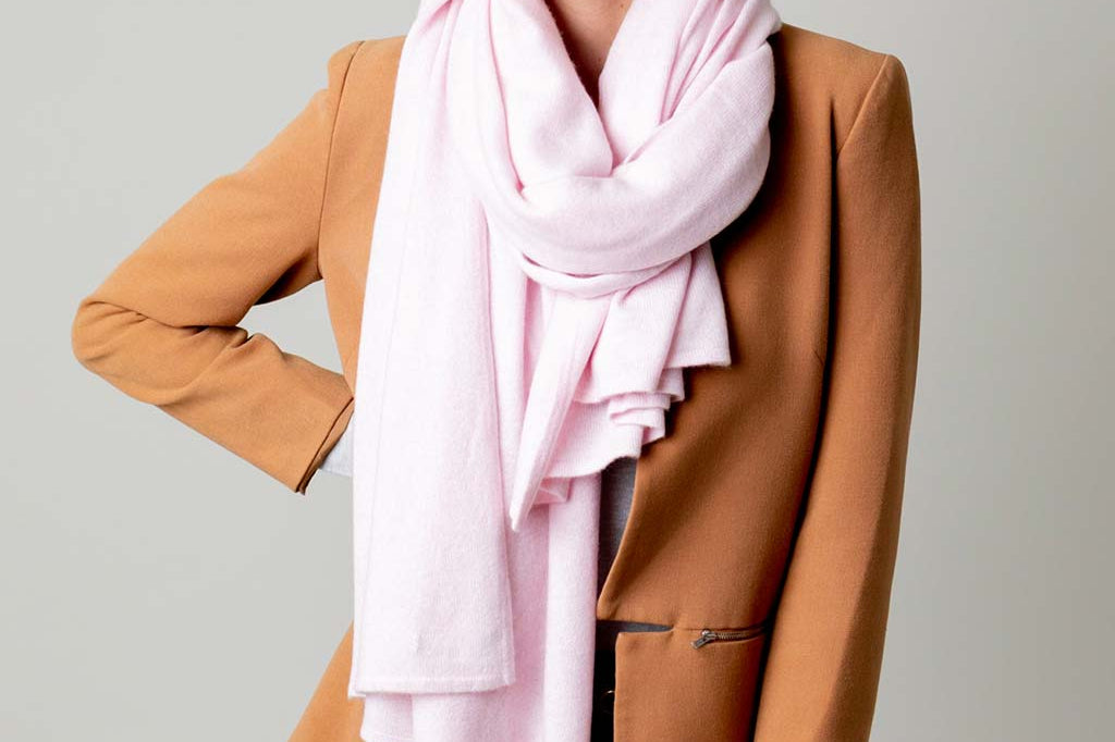 Model Wearing Alpine Cashmere's Luxurious Chunky Travel Wrap in Ballet Pink