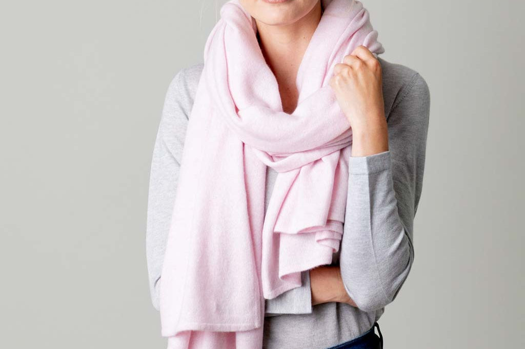Model Wearing Alpine Cashmere's Luxurious Chunky Travel Wrap in Ballet Pink