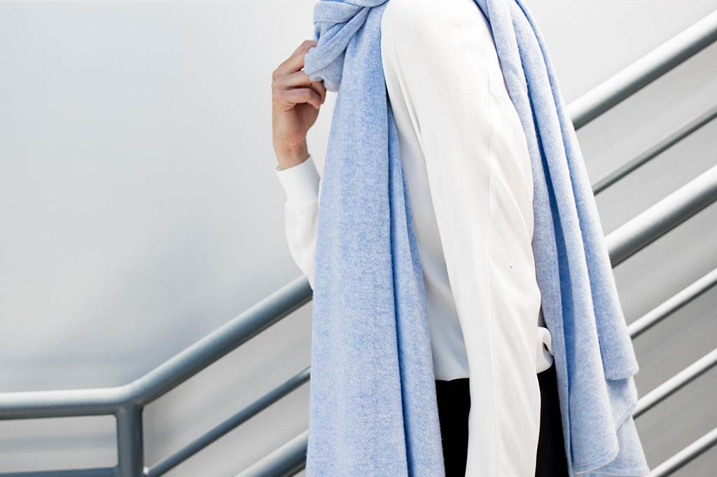 Model Wearing Alpine Cashmere's Luxurious Chunky Travel Wrap in Frost Blue