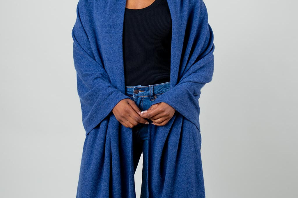 Model Wearing Alpine Cashmere's Luxurious Chunky Travel Wrap in Indigo Blue