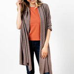 Model Wearing Alpine Cashmere's Luxurious Chunky Travel Wrap in Nutmeg Brown
