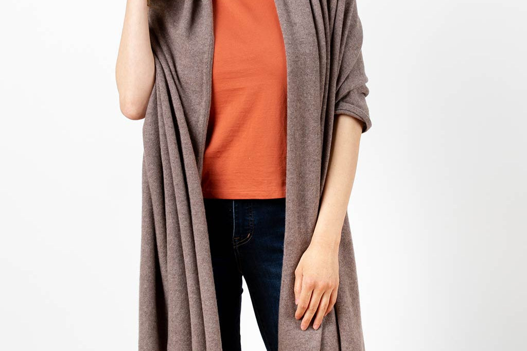 Model Wearing Alpine Cashmere's Luxurious Chunky Travel Wrap in Nutmeg Brown