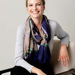 Model Wearing Alpine Cashmere's Featherweight Cinta Scarf in Blue and Taupe