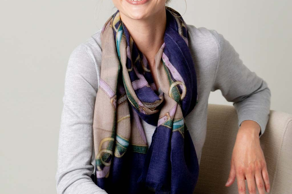 Model Wearing Alpine Cashmere's Featherweight Cinta Scarf in Blue and Taupe