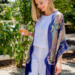 Model Wearing Alpine Cashmere's Featherweight Cinta Scarf in Blue and Taupe