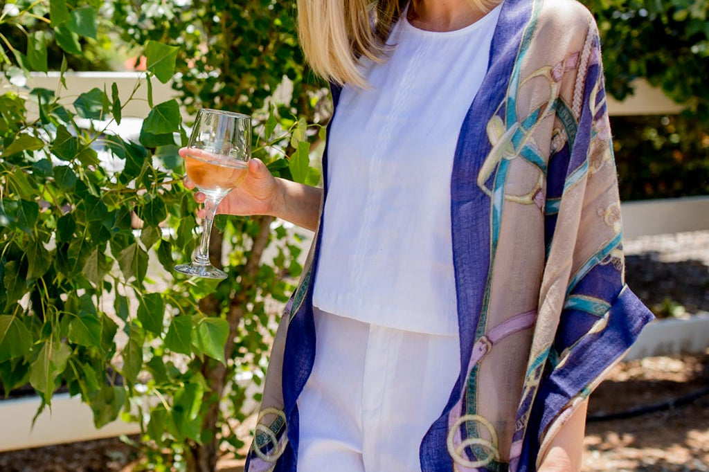 Model Wearing Alpine Cashmere's Featherweight Cinta Scarf in Blue and Taupe