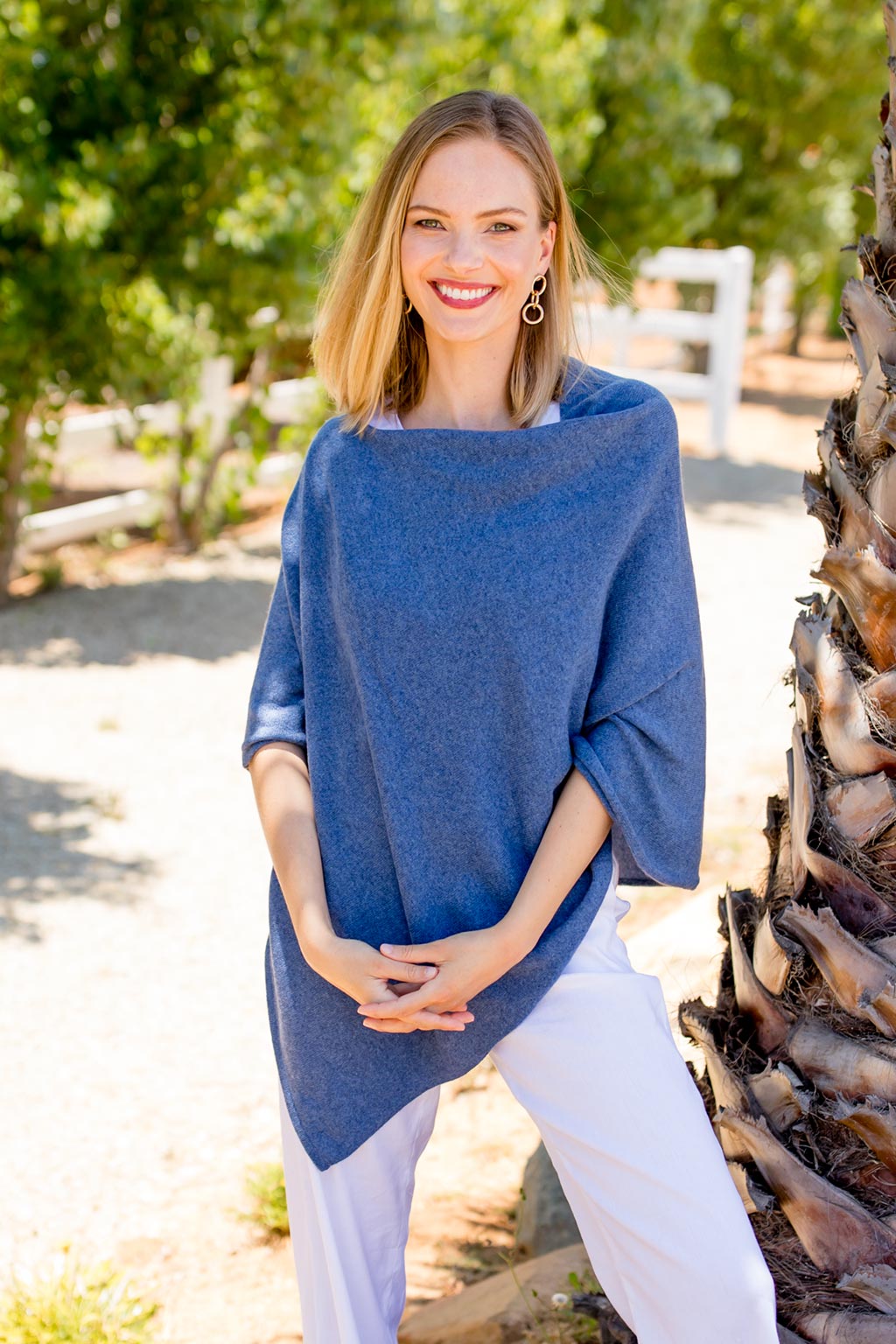 Model Wearing Alpine Cashmere's Classic Poncho in Denim Blue