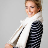 Model Wearing Alpine Cashmere Ripple Finish Wrap in Cream