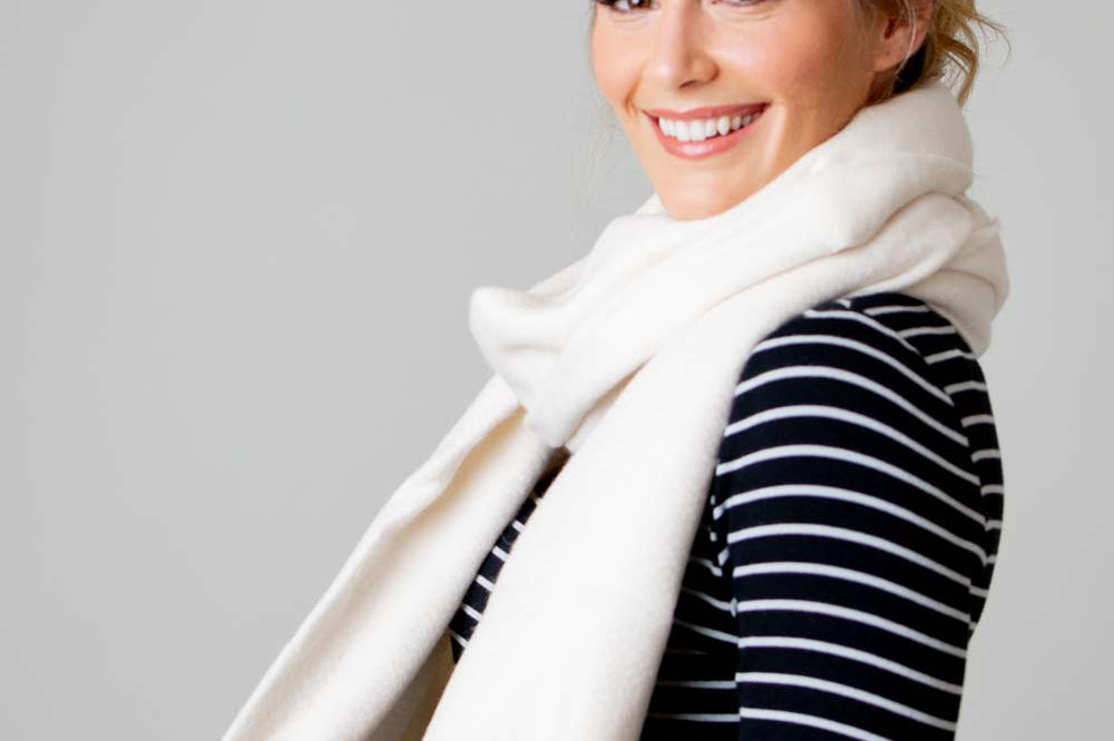 Model Wearing Alpine Cashmere Ripple Finish Wrap in Cream