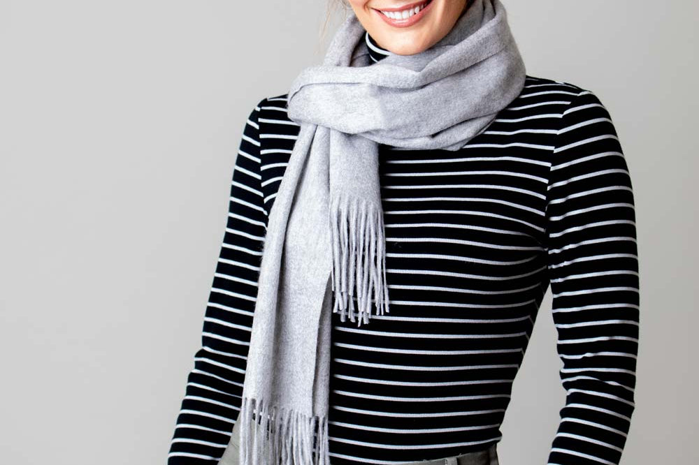 Model Wearing Alpine Cashmere Ripple Finish Scarf in Dove Gray