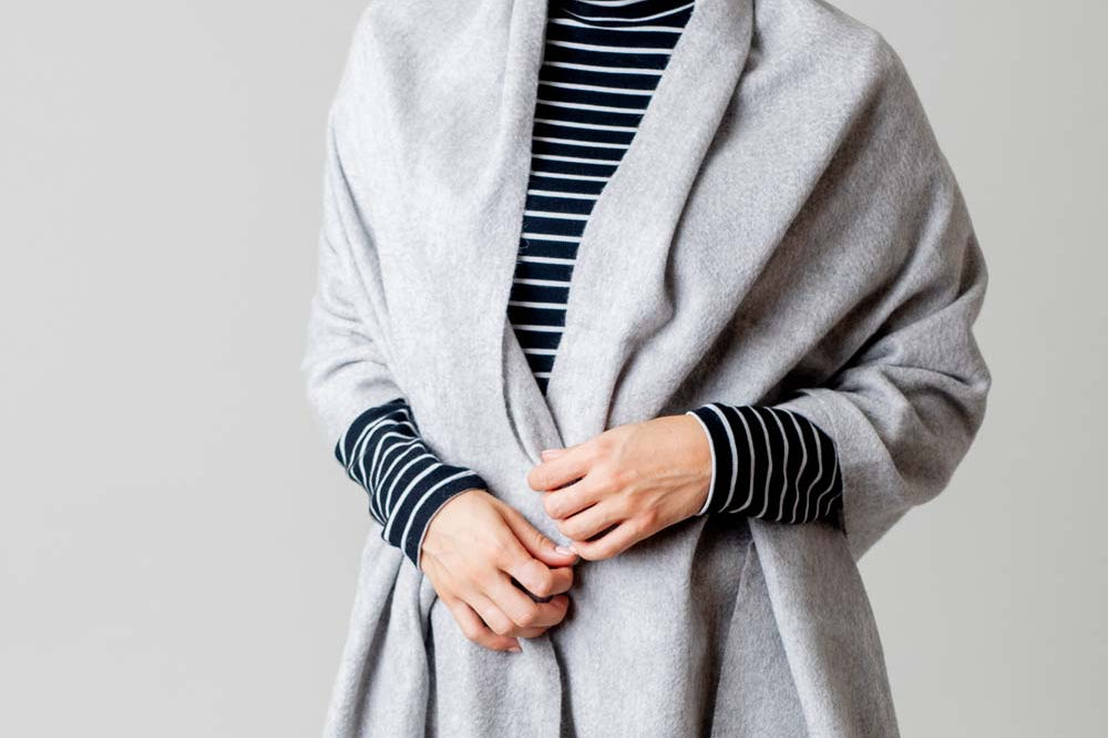 Model Wearing Alpine Cashmere Ripple Finish Wrap in Dove Gray