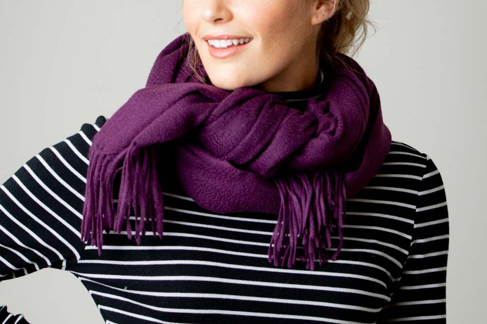 Model Wearing Alpine Cashmere Ripple Finish Wrap in Eggplant Purple