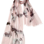 Alpine Cashmere's Dog's Life Scarf, featuring an illustrated print of dogs, in blossom pink