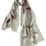 Alpine Cashmere's Dog's Life Scarf, featuring an illustrated print of dogs, in thunder gray