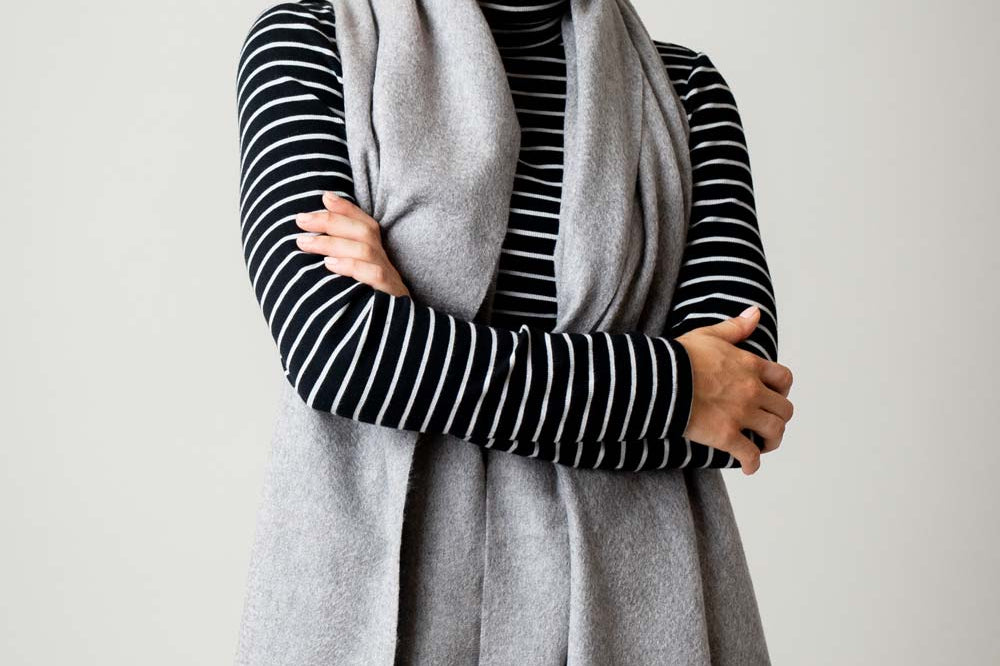 Model Wearing Alpine Cashmere Ripple Finish Wrap in Flannel Gray