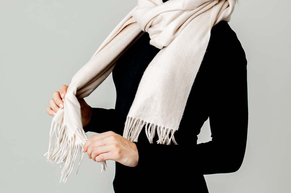 Model Wearing Alpine Cashmere Ripple Finish Wrap in Flax