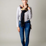 Model Wearing Alpine Cashmere's Grande Siena Scarf in Cream Made in Italy