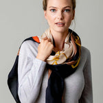 Model Wearing Alpine Cashmere's Grande Siena Scarf in Cream Made in Italy