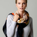 Model Wearing Alpine Cashmere's Grande Siena Scarf in Cream Made in Italy
