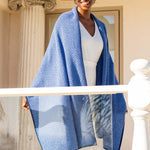 Model Wearing the Alpine Cashmere Herringbone Travel Wrap in Admiral and Wave Blue