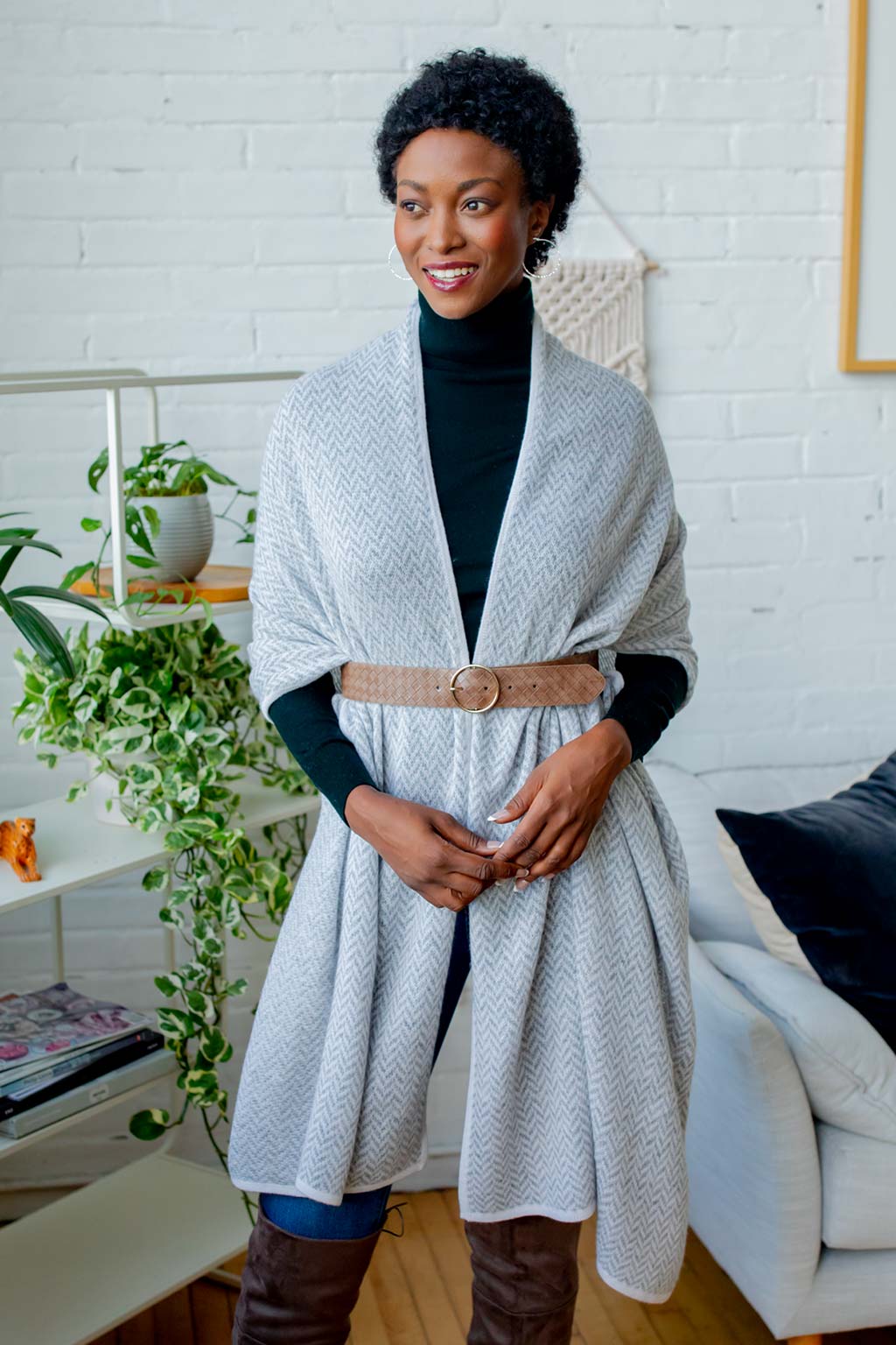 Model Wearing the Alpine Cashmere Herringbone Travel Wrap in Birch Gray and Ivory