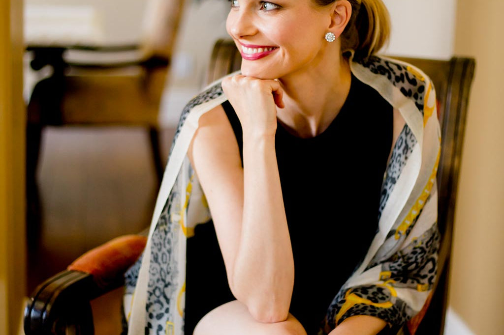Model Wearing Alpine Cashmere Leopardo Scarf in Gold