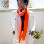 Model Wearing Alpine Cashmere Ombre Scarf in Papaya and Ecru