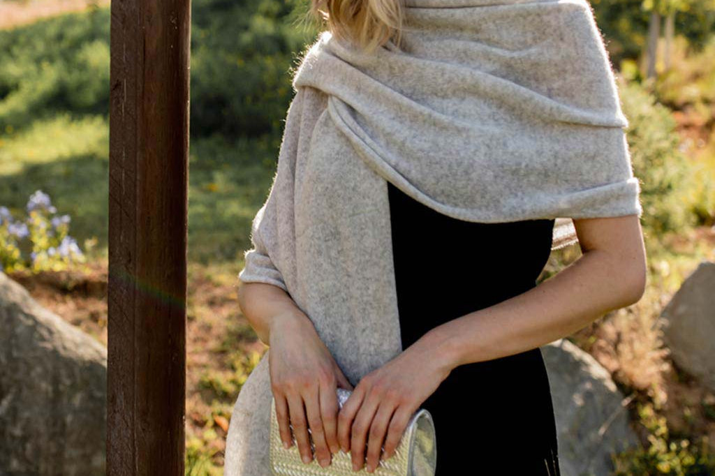 Model Wearing Alpine Cashmere Passport Travel Wrap in Flint Gray