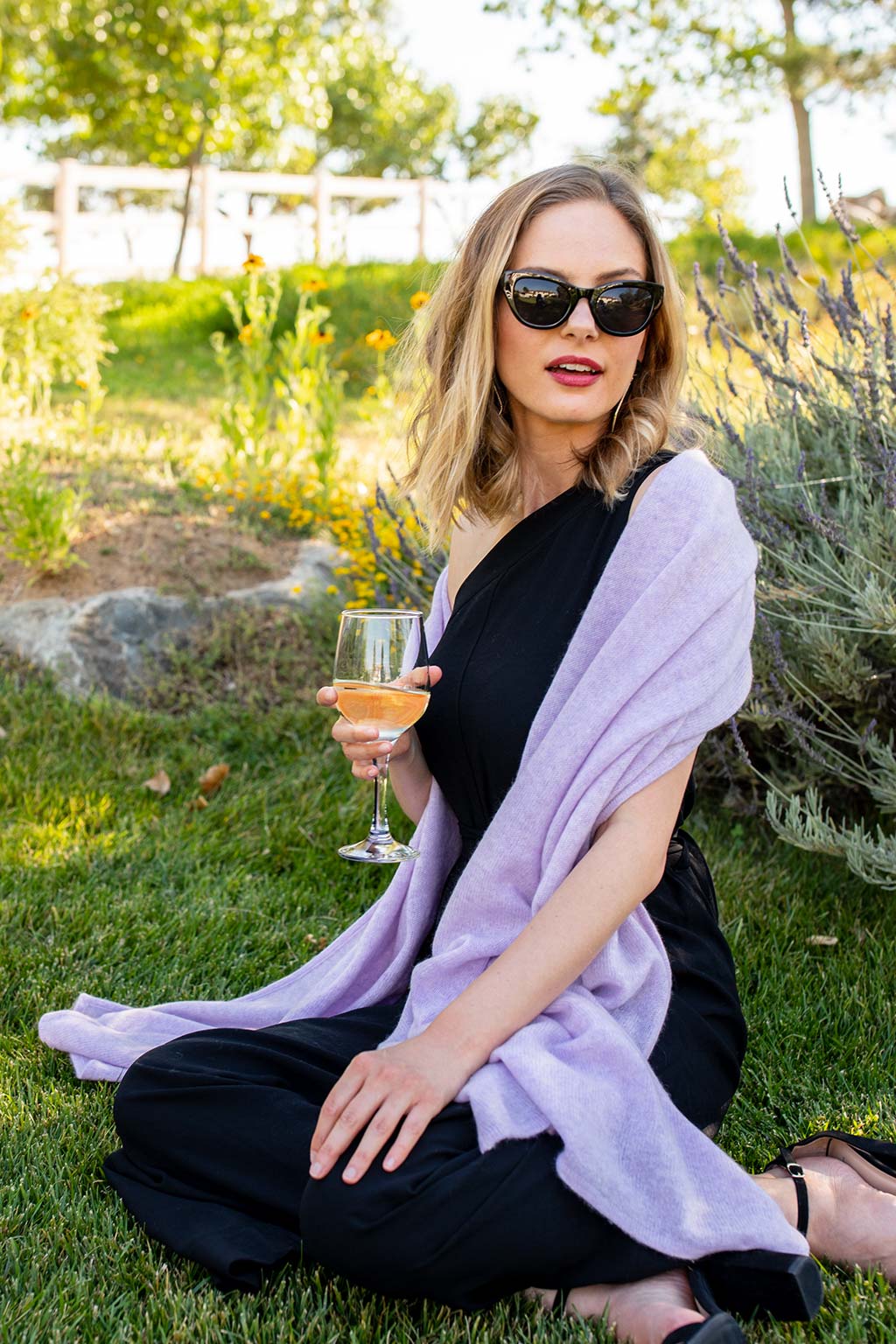 Model Wearing Alpine Cashmere Passport Travel Wrap in Lilac Purple