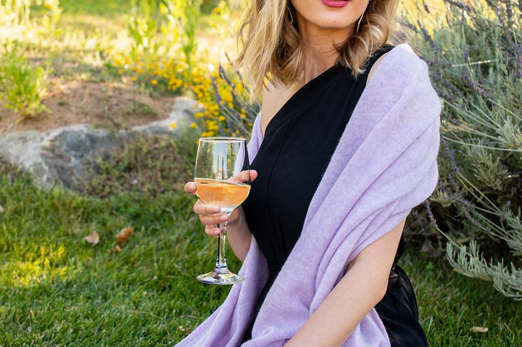 Model Wearing Alpine Cashmere Passport Travel Wrap in Lilac Purple