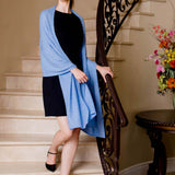 Model Wearing Alpine Cashmere Passport Travel Wrap in Wave Blue