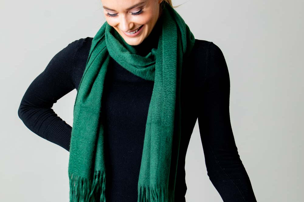 Model Wearing Alpine Cashmere Ripple Finish Scarf in Pine Green