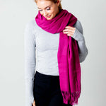 Model Wearing Alpine Cashmere Ripple Finish Wrap in Plum Purple