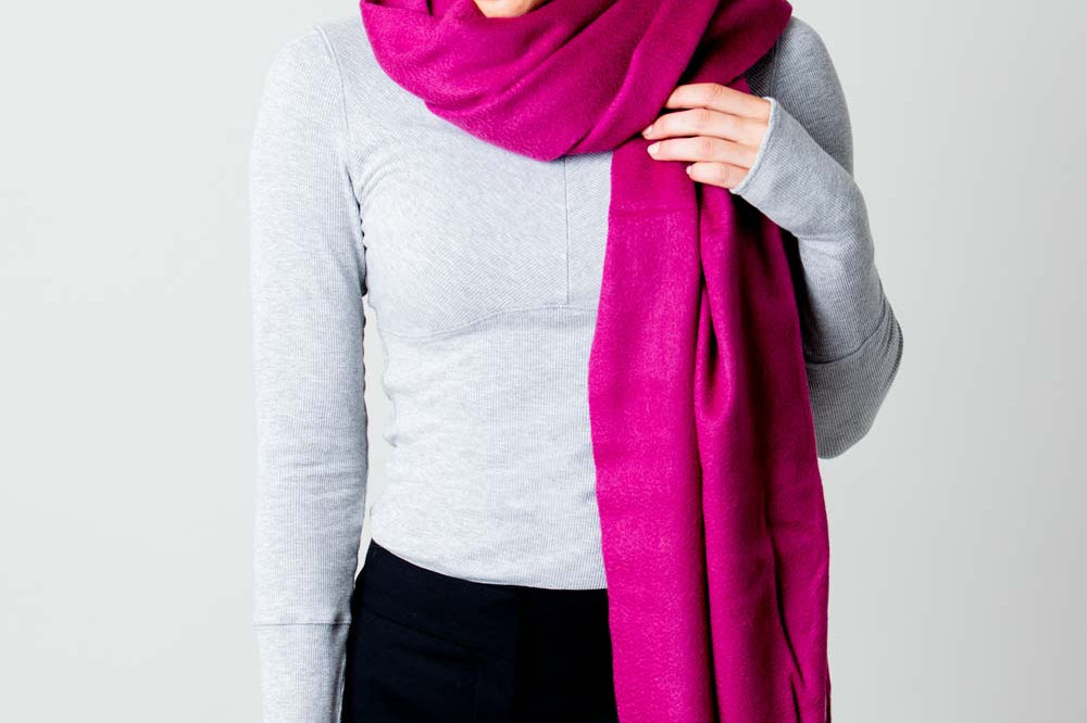 Model Wearing Alpine Cashmere Ripple Finish Wrap in Plum Purple