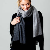Model Wearing Alpine Cashmere Ripple Finish Reversible Wrap in Charcoal and Cinder Gray