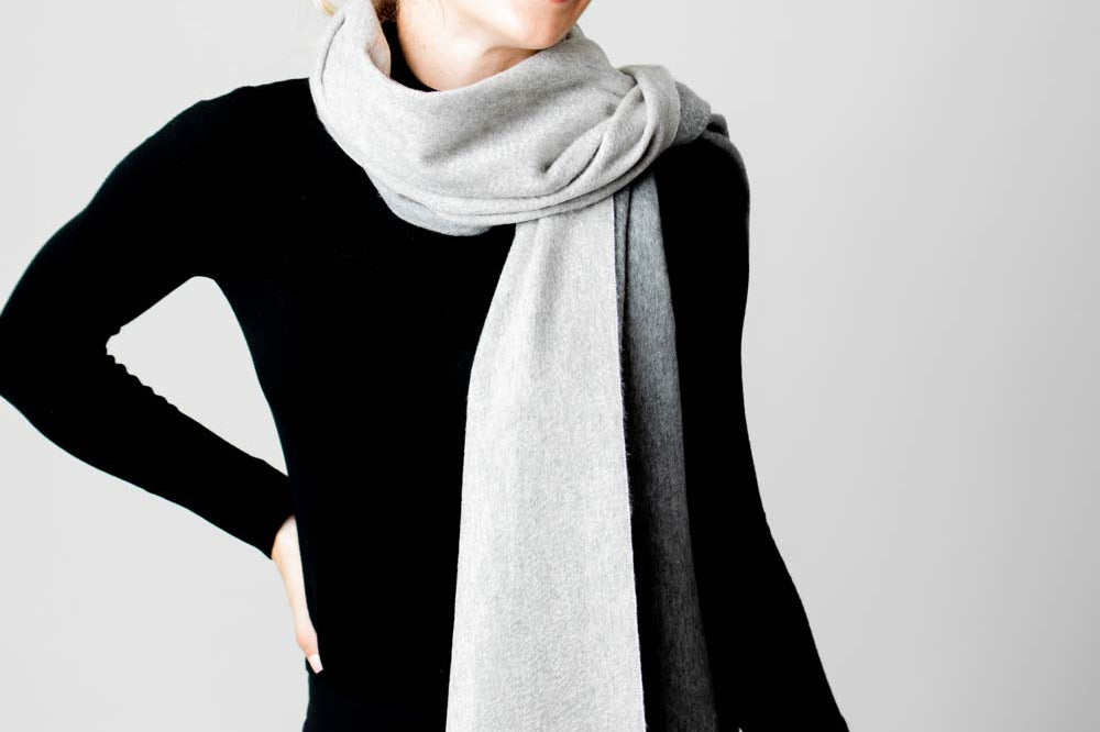 Model Wearing Alpine Cashmere Ripple Finish Reversible Wrap in Smoke and Ash Gray