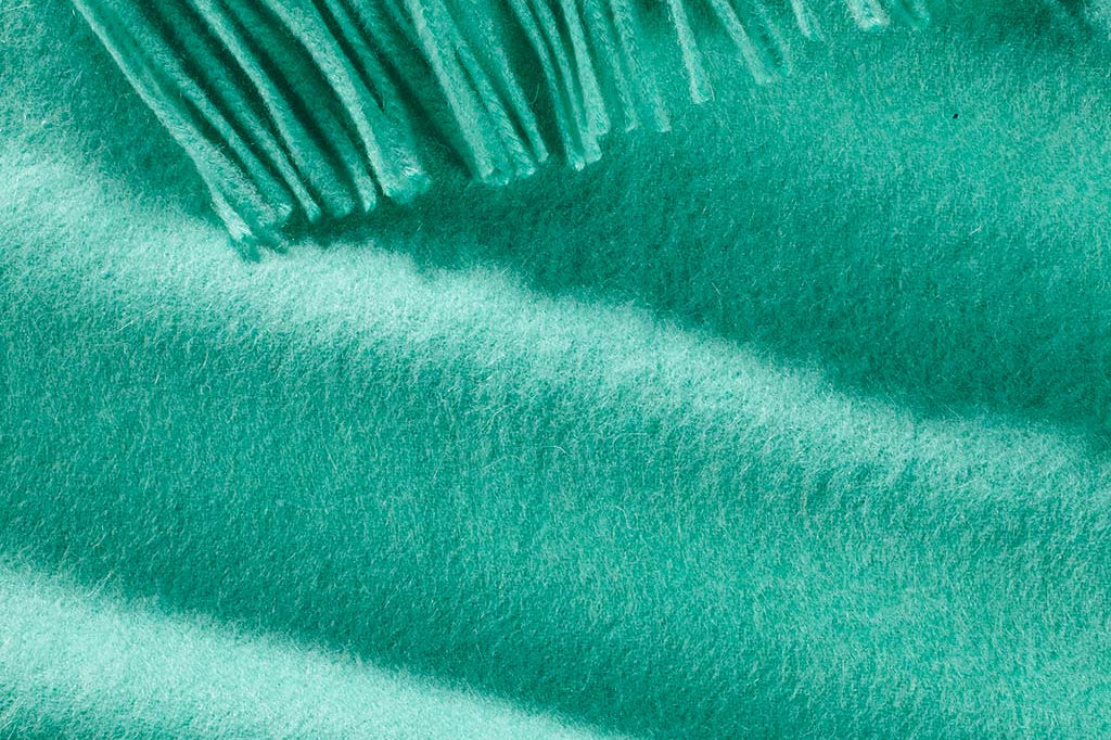 Model Wearing Alpine Cashmere Ripple Finish Wrap in Aqua