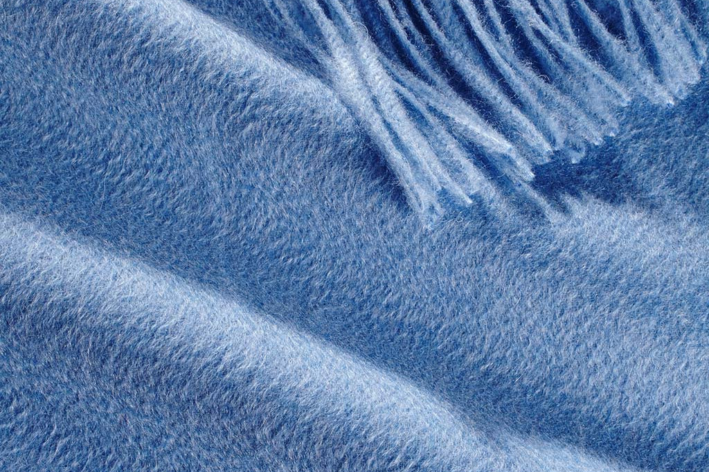 Model Wearing Alpine Cashmere Ripple Finish Wrap in Azure Blue
