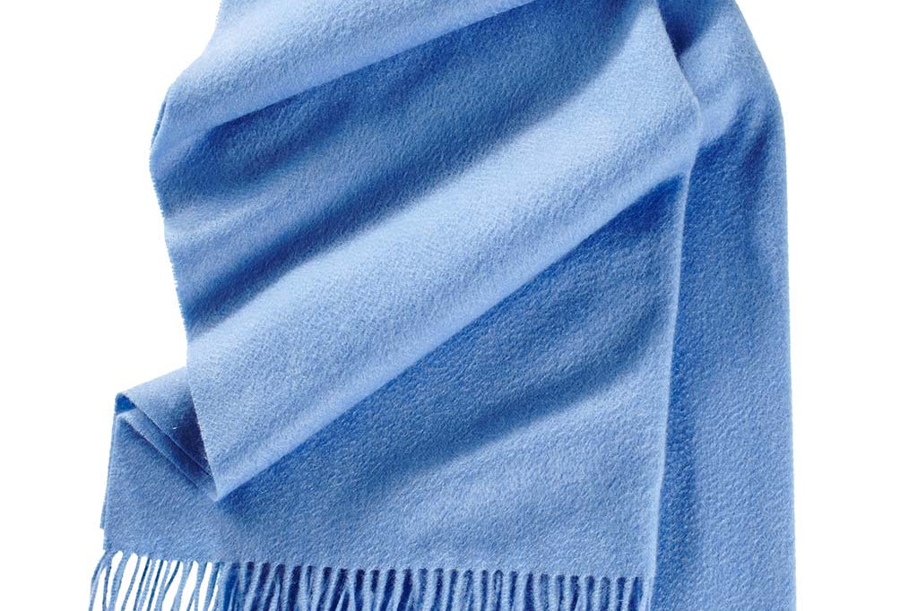 Model Wearing Alpine Cashmere Ripple Finish Wrap in Azure Blue