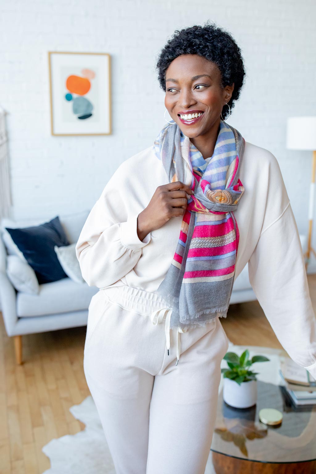 Model Wearing Alpine Cashmere Featherweight Printed Roma Scarf in Anchor Gray