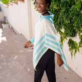 Model Wearing Alpine Cashmere Striped Poncho in Aquamarine and Ecru