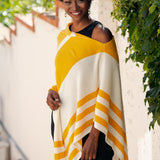 Model Wearing Alpine Cashmere Striped Poncho in Marigold and Ecru
